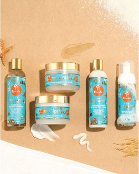 CURLS bottle next to common items for scale showing the 8oz size for travel-friendly cleansing