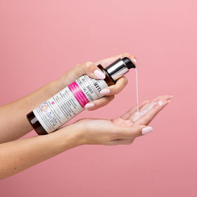 CURLSMITH applying lotion to wet curls for immediate root lift and definition