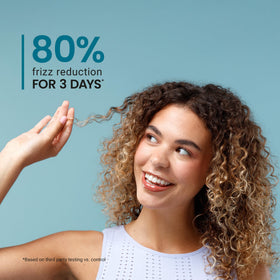 CURLSMITH applied to damp curls showing defined styling benefit