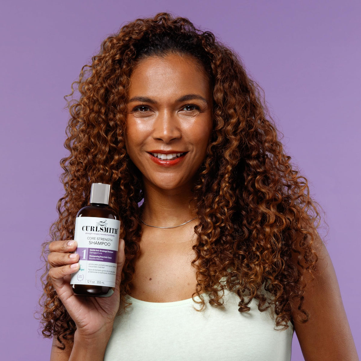CURLSMITH shampoo styled with curly model showing defined bounce benefit