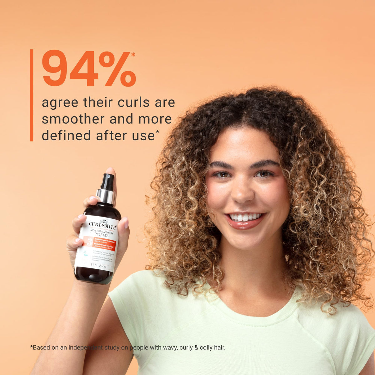 CURLSMITH product being combed through curls to illustrate easy detangling