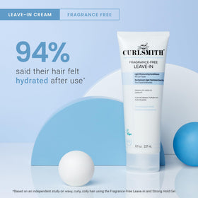 CURLSMITH applying leave-in to damp hair to hydrate and define curls