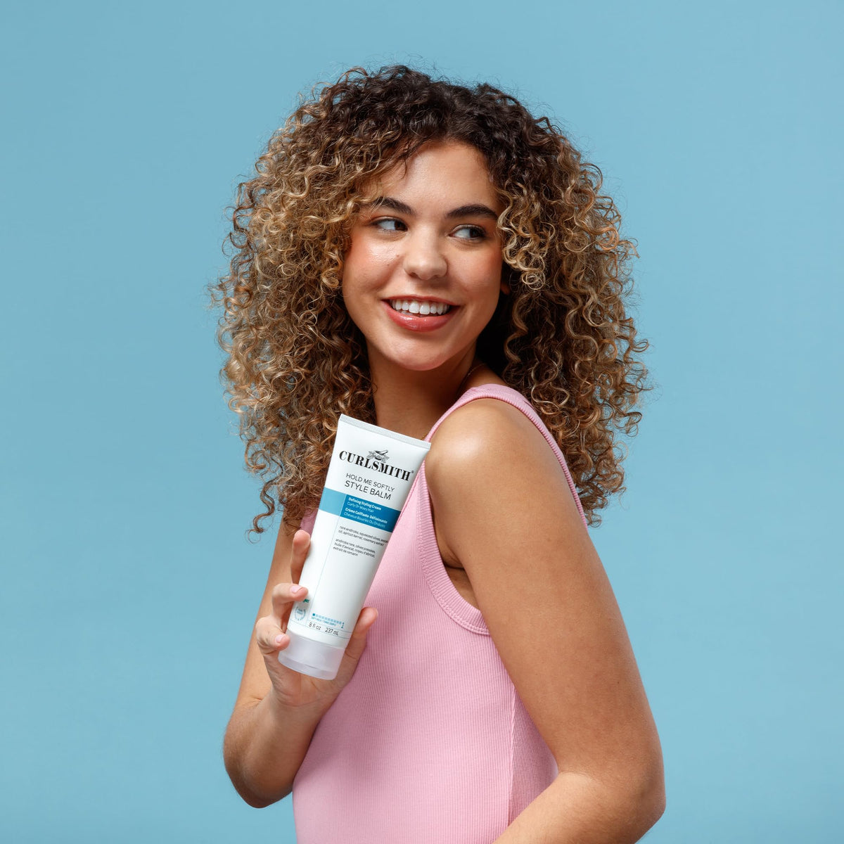 CURLSMITH styled wavy hair in lifestyle scene showing soft definition and movement