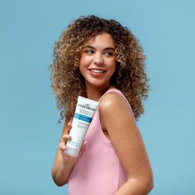 CURLSMITH styled wavy hair in lifestyle scene showing soft definition and movement