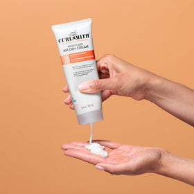 CURLSMITH placed on bathroom shelf to illustrate daily styling use
