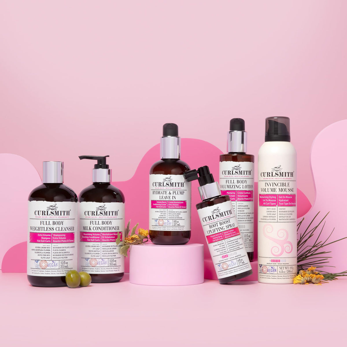 CURLSMITH bottle staged with styling tools showing easy routine integration