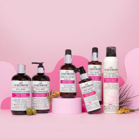 CURLSMITH bottle staged with styling tools showing easy routine integration