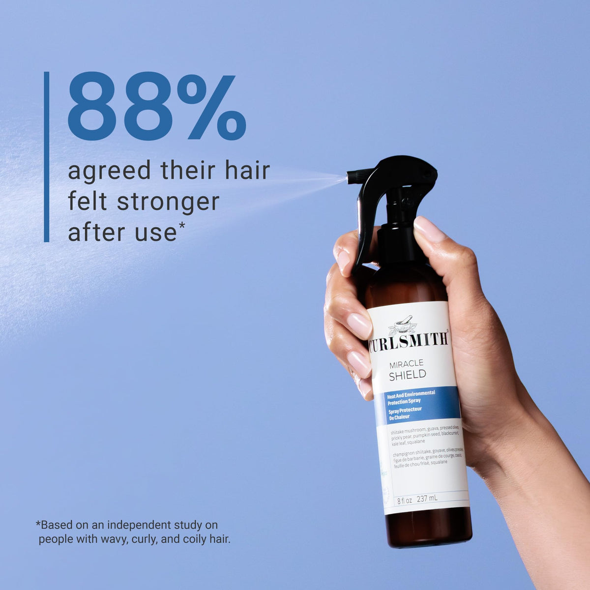 CURLSMITH 8 oz bottle next to hand for scale and travel-friendly benefit