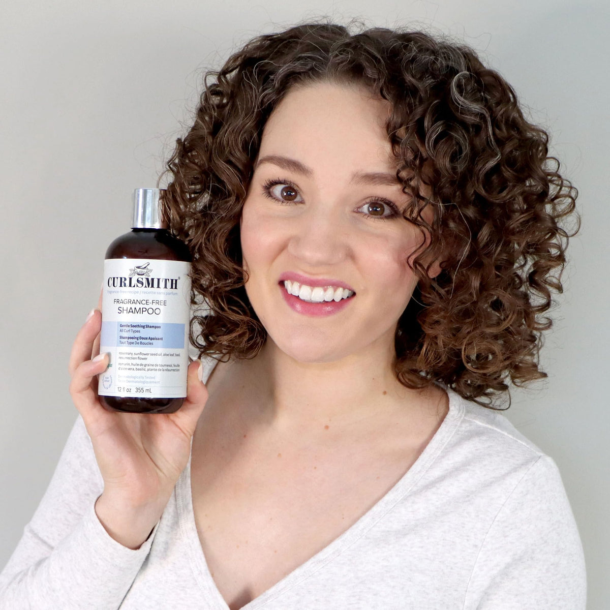 CURLSMITH 12 oz bottle next to ruler illustrating true product size