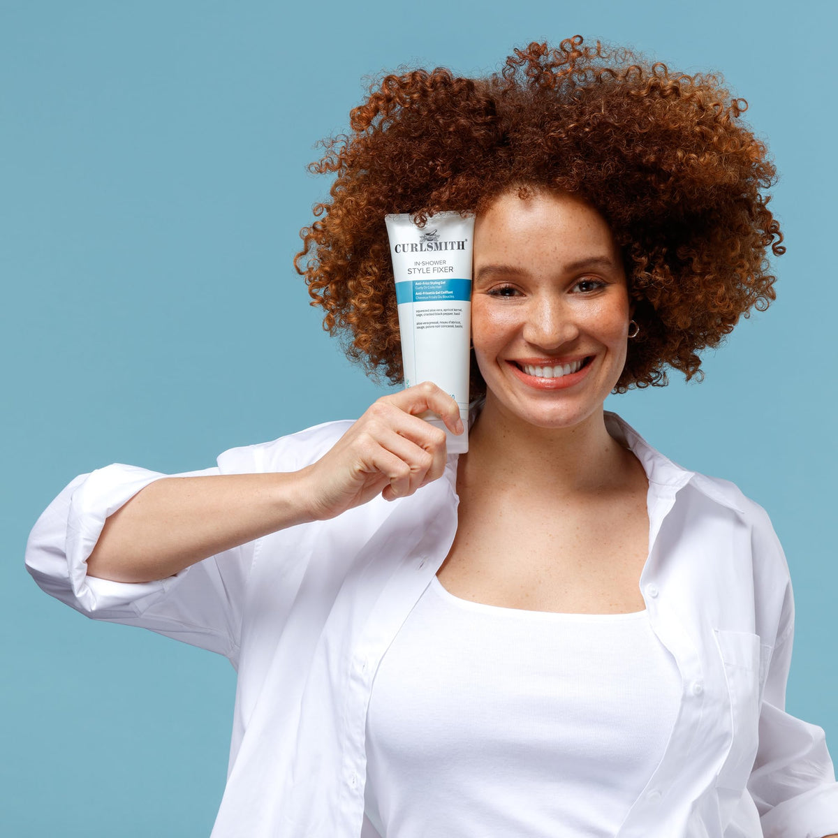 CURLSMITH 8 oz bottle in hand to show actual product size