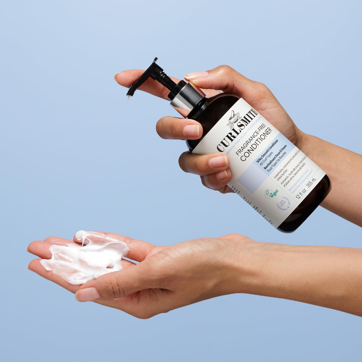 CURLSMITH conditioner spread on palm illustrating slip for gentler combing benefit