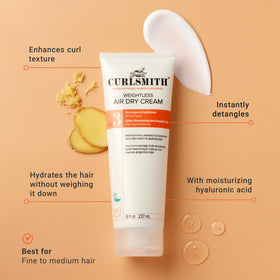 CURLSMITH travel kit flatlay with travel essentials showing portability for trips