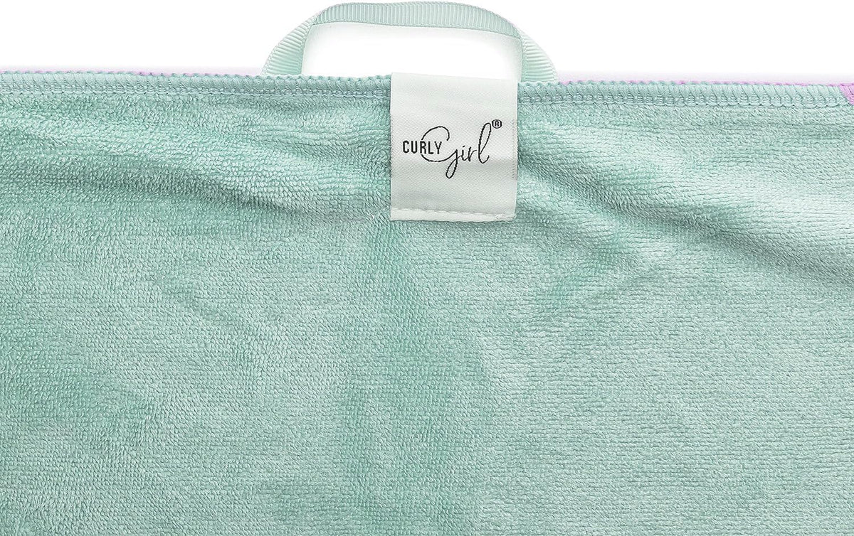 Curly Girl towel absorbing water demonstration, speeds drying benefit