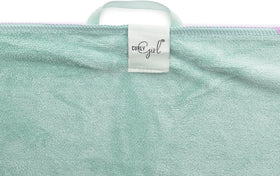 Curly Girl towel absorbing water demonstration, speeds drying benefit