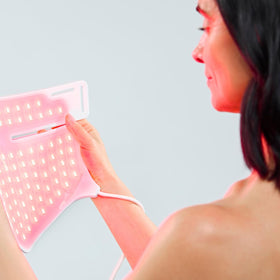 CurrentBody wearable mask in a relaxed home setting demonstrating easy at-home routine
