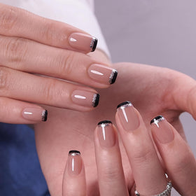 CurvLife on hand model demonstrating polished short square French tips for instant style