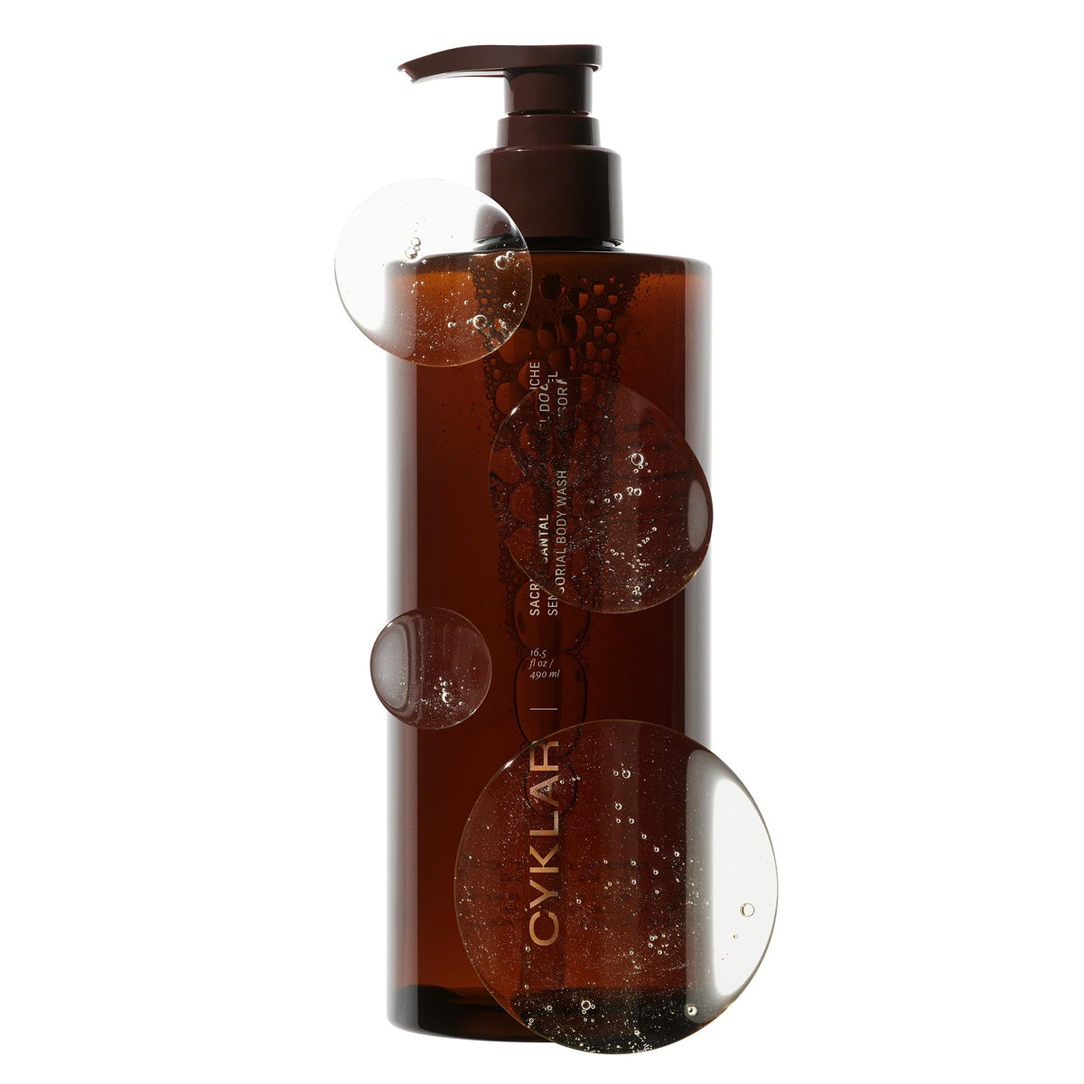 CYKLAR bottle front view showing Sacred Santal luxury packaging and fragrance benefit