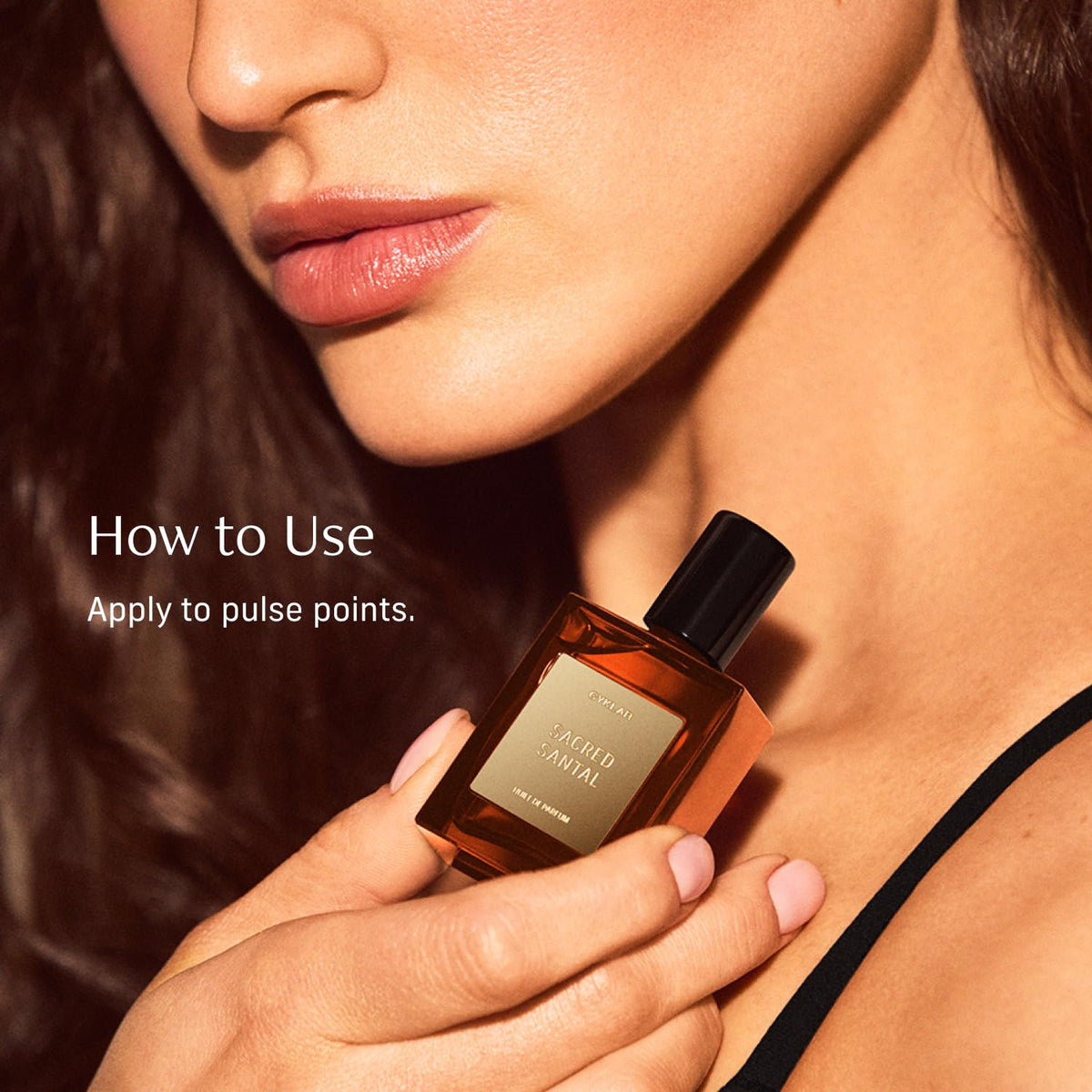 CYKLAR Sacred Santal held in hand to show 15ml size and convenient everyday portability