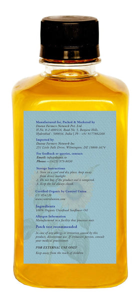 DAANA bottle held in hand demonstrating 12 fl oz scale