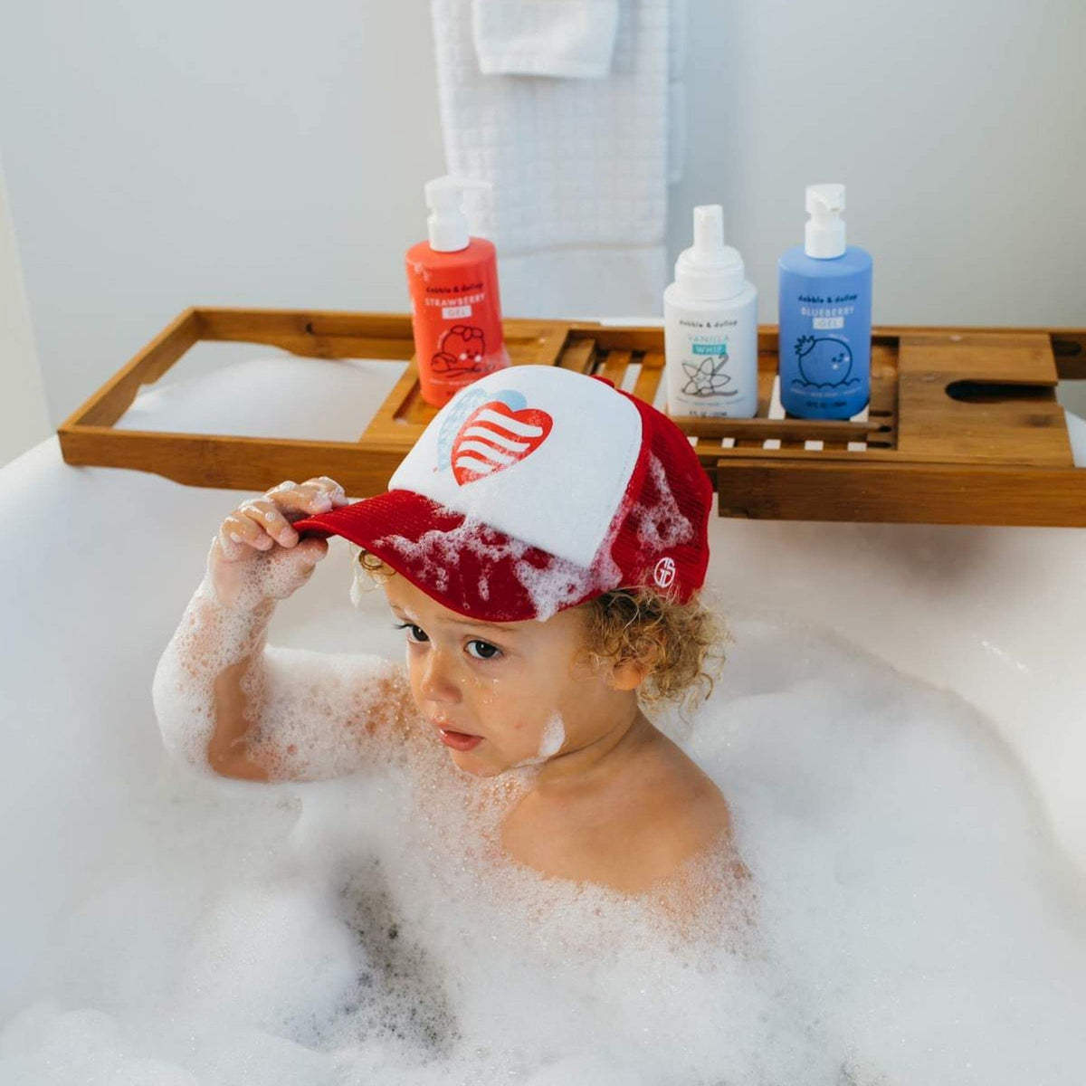 Dabble & Dollop blueberry whipped foam pump producing airy foam for playful baths