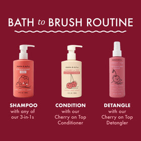 Dabble & Dollop child brushing hair after spray to reduce tears and make styling simpler
