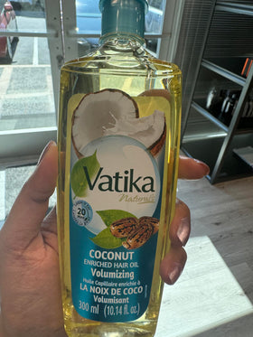 Dabur Vatika bottle pour detail demonstrating controlled dispensing and easy application