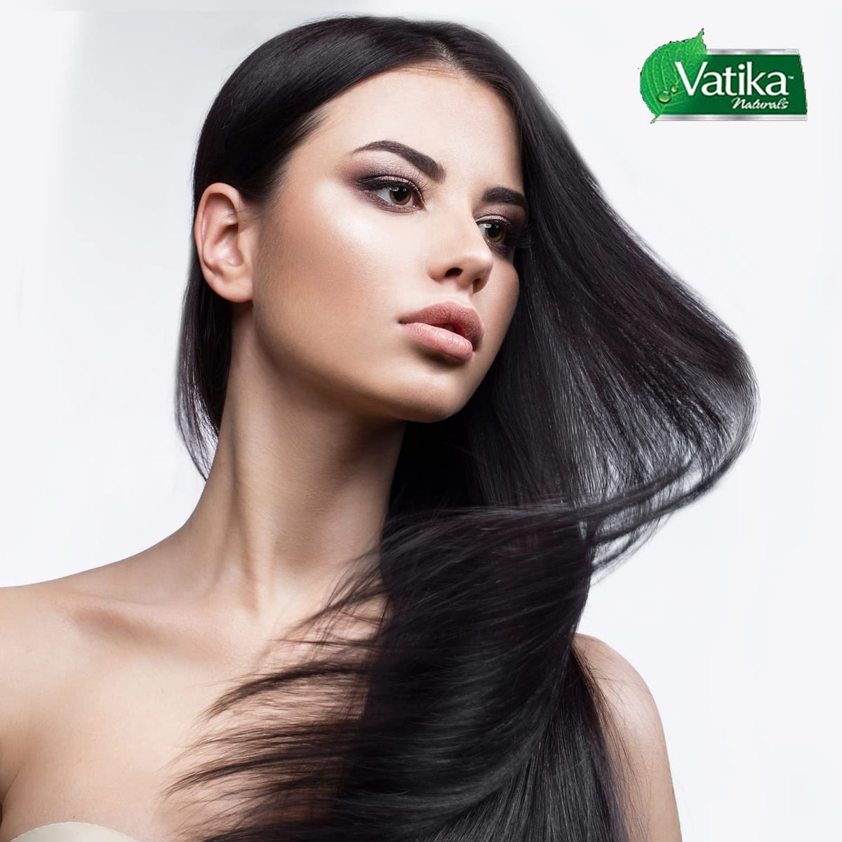 Dabur Vatika bottle styled on bathroom shelf suggesting daily hair care routine