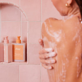 DAE lifestyle shower shelf image offering a bright citrus scent and tidy bathroom look