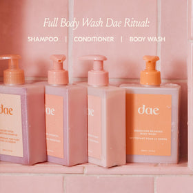 DAE bottle next to hand for size scale and easy everyday use convenience