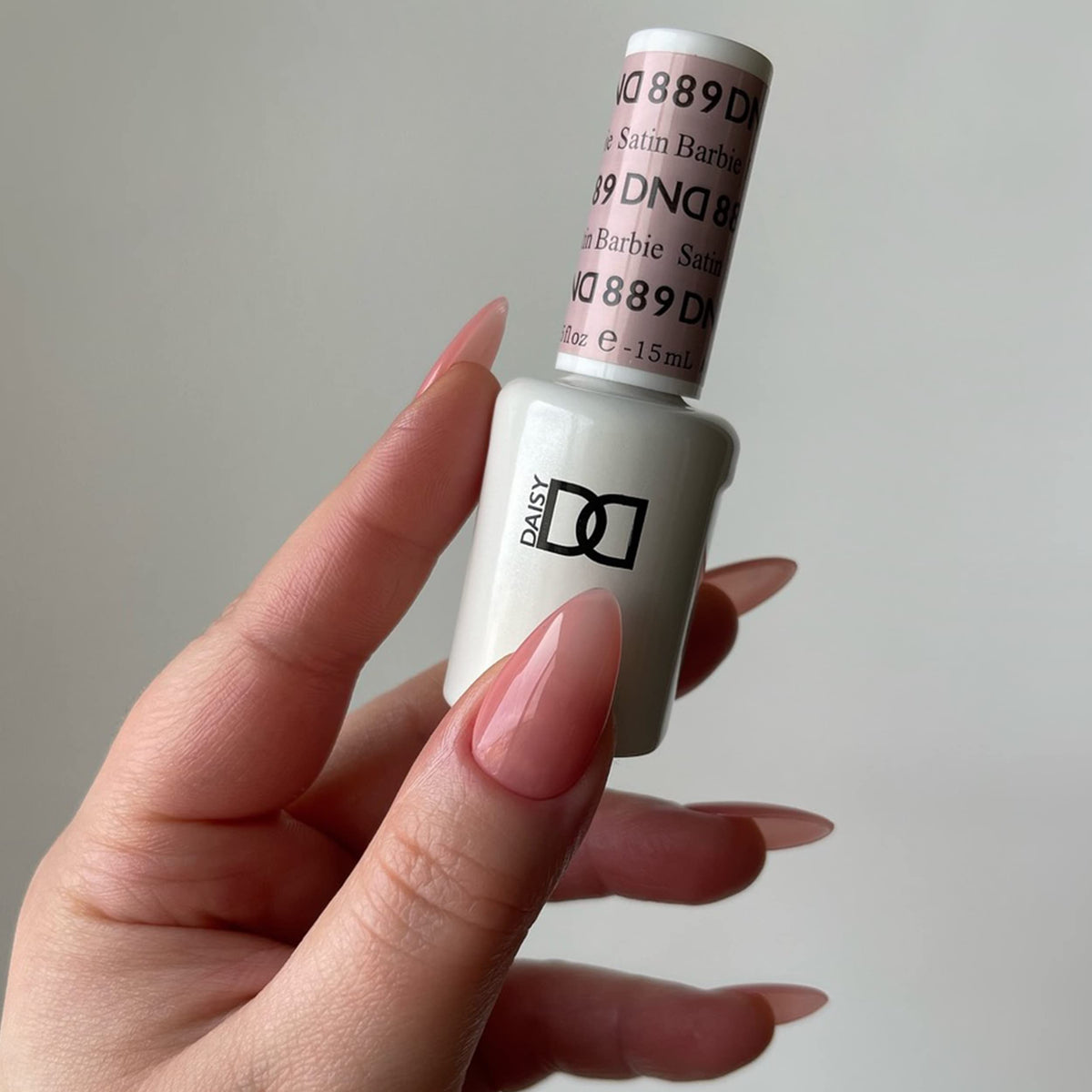 DAISY DND 889 Satin gel and lacquer bottles side-by-side for matching color benefit