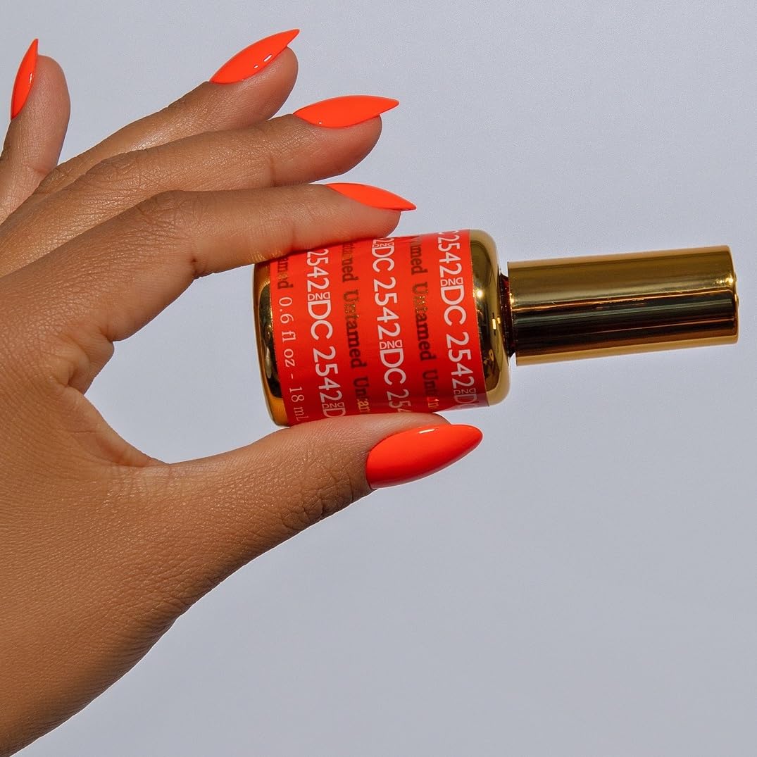 DAISY DND nail swatch on fingertip displaying vivid Untamed payoff