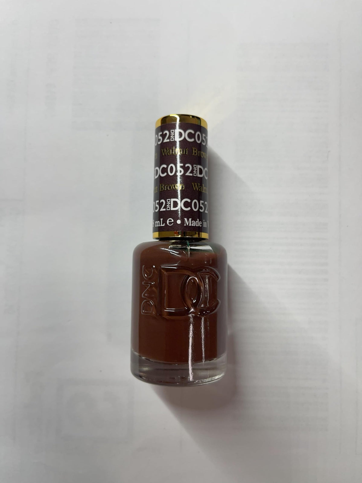 DAISY DND salon scene with technician applying Walnut Brown duo