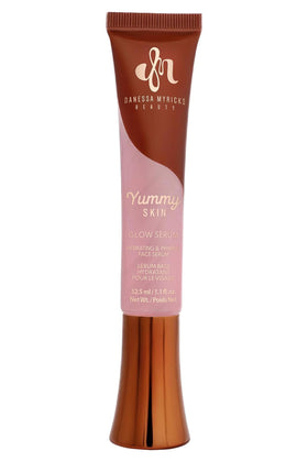 Danessa Myricks front packaging showing soft-pink serum and product name, highlighting glow