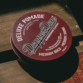 Dapper Dan 100ml jar beside coin for size comparison and travel-friendly convenience