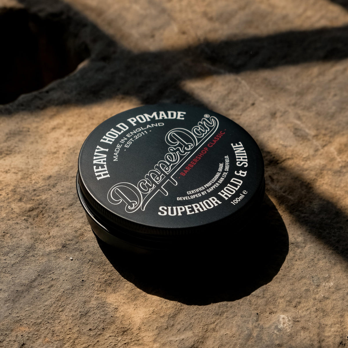 Dapper Dan pomade texture close-up displaying rich consistency for strong hold