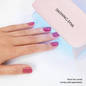 Dashing Diva application step pressing strip indicating simple, no-mess placement and adhesion