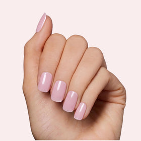 Dashing Diva LED lamp curing a nail strip, quick 60-second professional finish