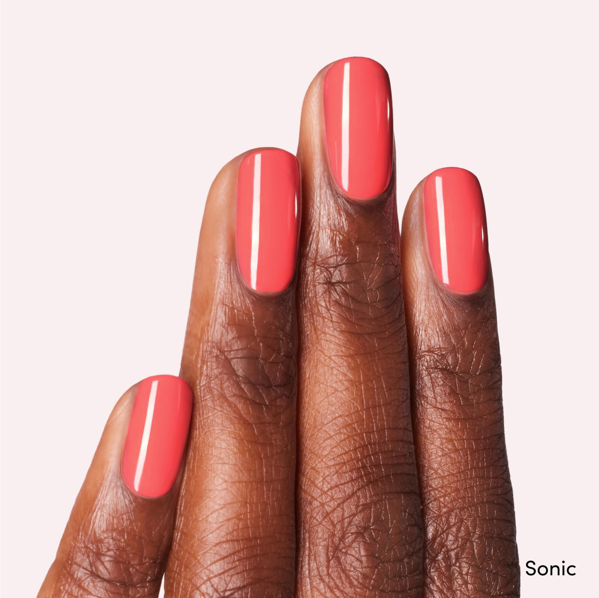 Dashing Diva Sonic bottle close-up showing grapefruit red shade and smooth finish