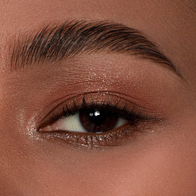 dasique palette held in hand to show scale and travel-friendly compact design