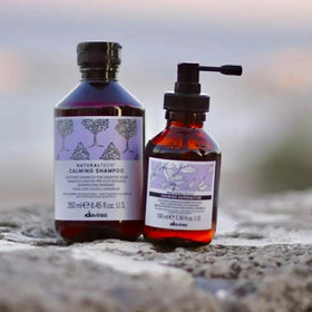 Davines bottle on bathroom shelf in lifestyle setting, calm routine benefit