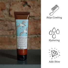 Davines conditioner being dispensed from bottle for controlled application
