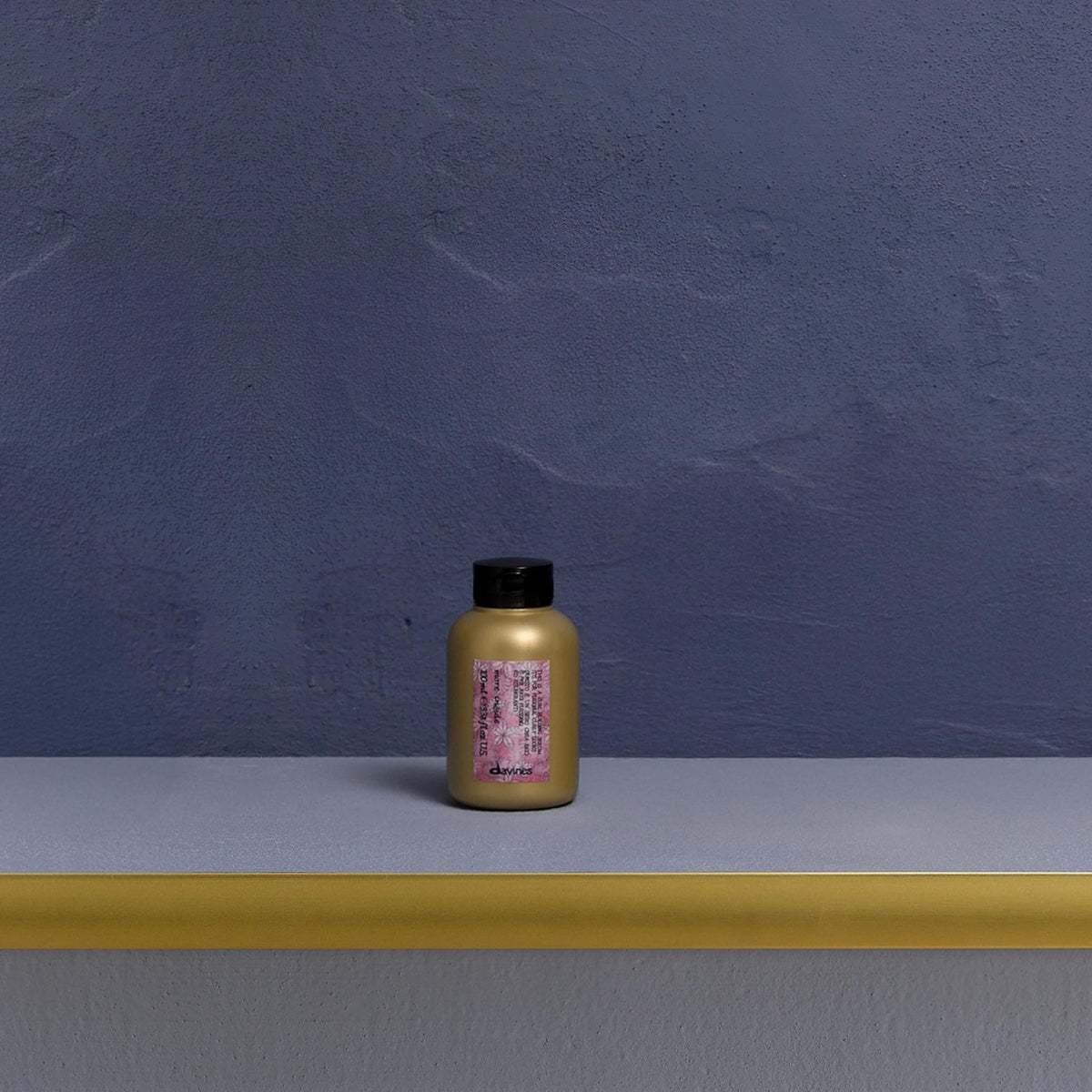 Davines serum texture on hand demonstrating lightweight spreadability