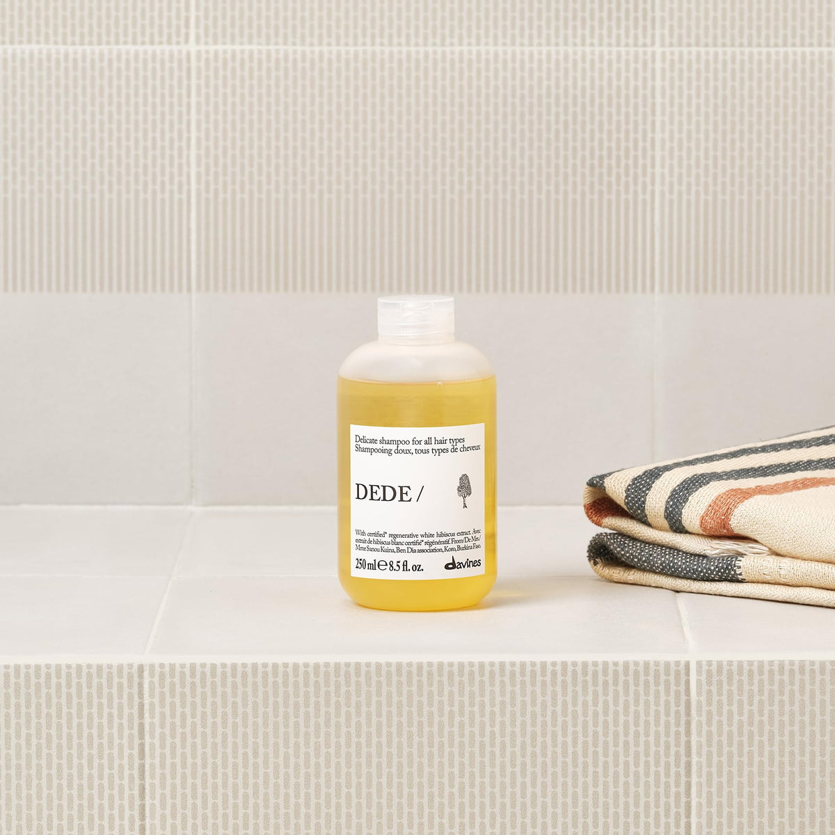 Davines DEDE/ back label detail showing ingredients and usage clarity benefit