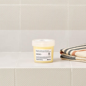 Davines DEDE conditioner cream consistency close-up showing smoothing benefit
