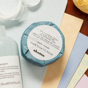 Davines forming pomade size next to ruler illustrating compact 2.54 fl oz portability