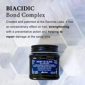 Davines applying conditioner to mid-lengths and ends for detangling benefit