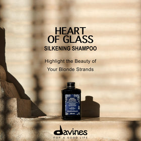 Davines blue shampoo foaming in hand demonstrating gentle cleansing power