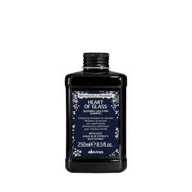 Davines bottle front view showing blue shampoo and elegant label for brightening