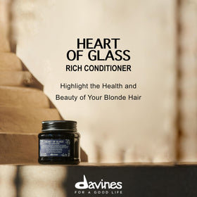 Davines Heart of Glass travel size in hand for portability and salon-quality care