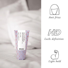 Davines before and after split image showing sleeker, satin-looking hair